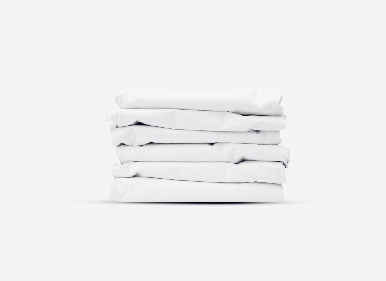 un mucchio di stoffe bianche piegate. concetto di panno in tessuto bianco ben progettato. mockup di texture tessili per l'anteprima del design creativo. foto