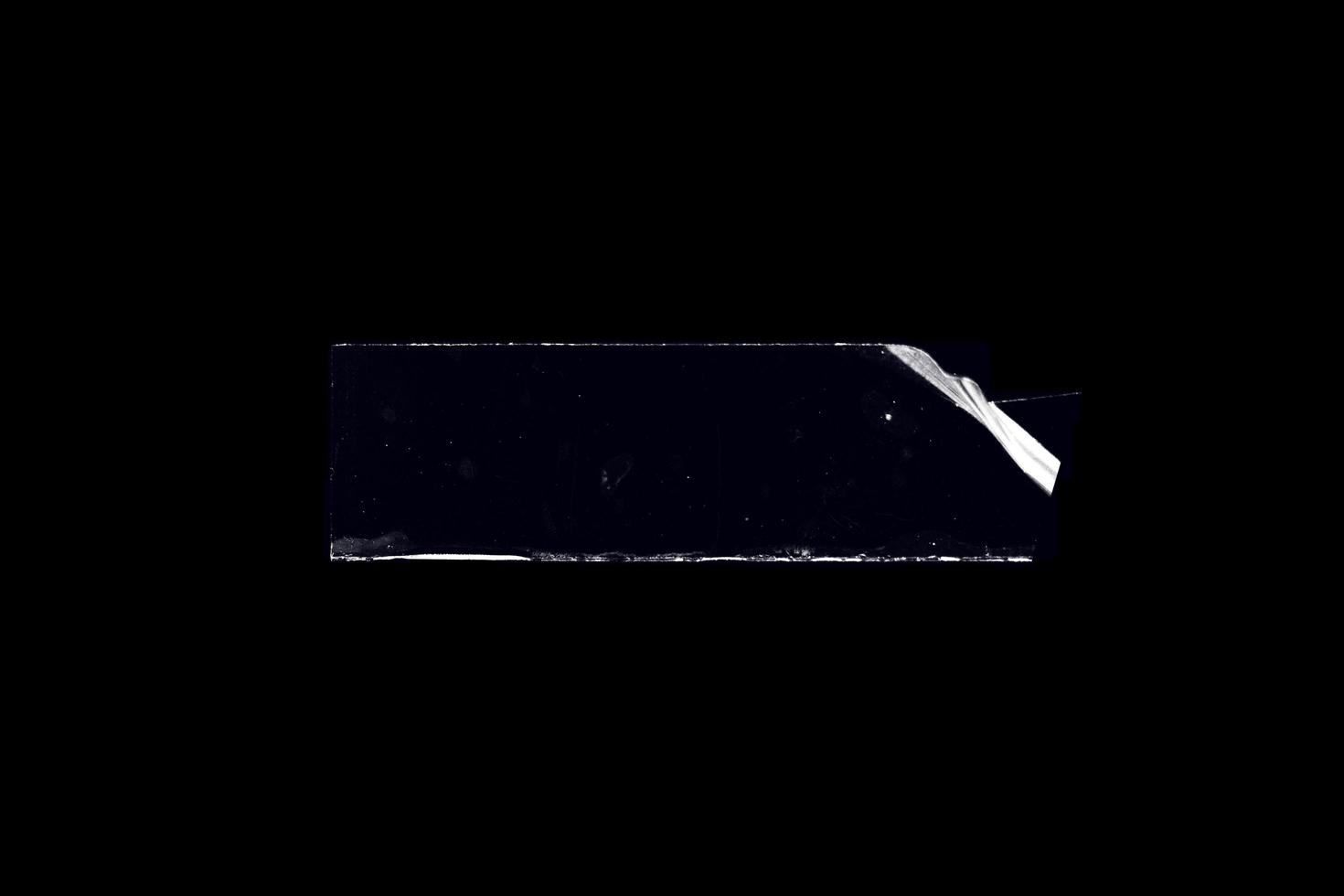 nastro adesivo trasparente su sfondo nero. nastro adesivo stropicciato astratto per elemento di design del poster o sovrapposizione foto