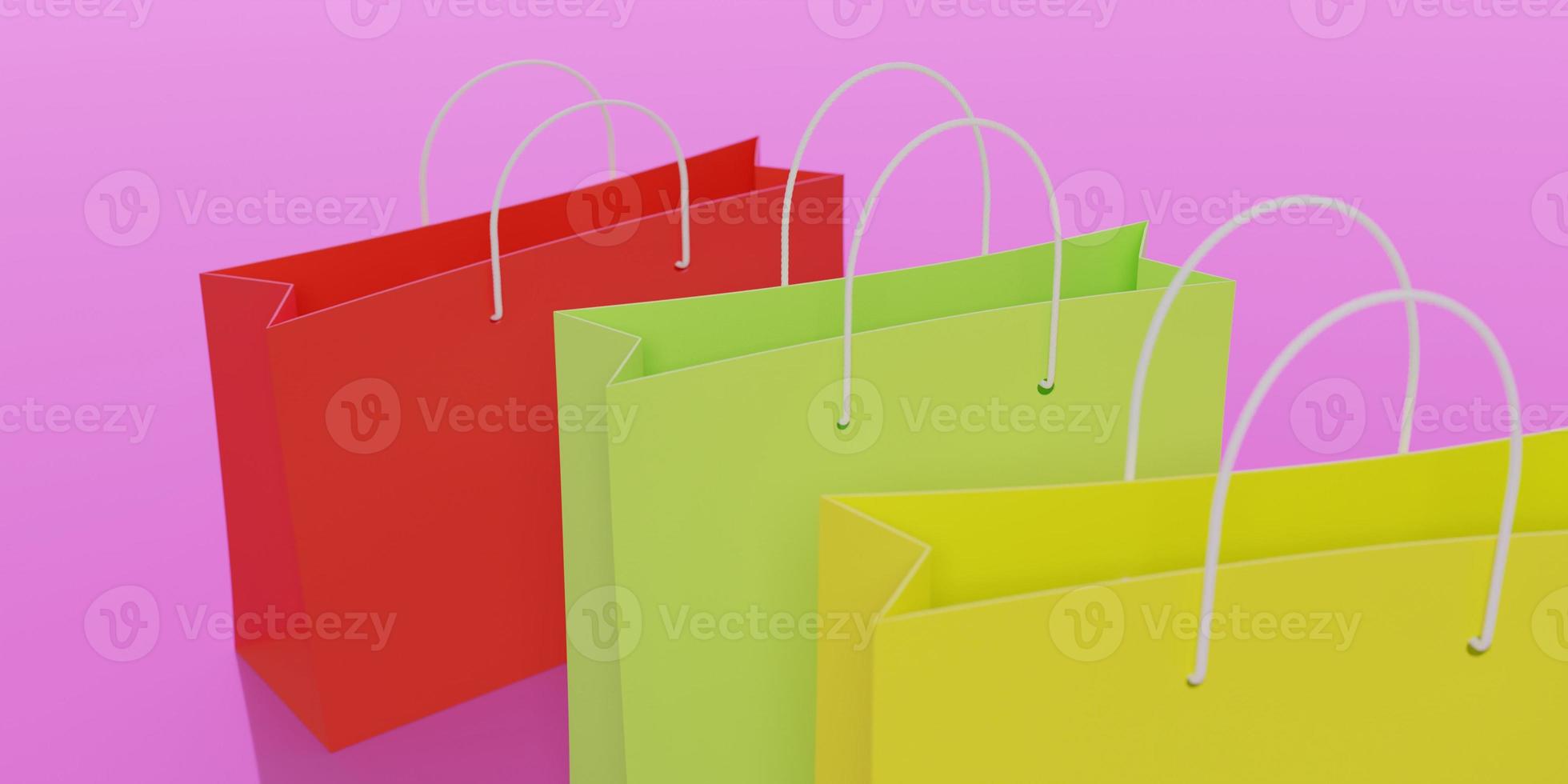 rendering 3D. sacchetti della spesa di carta rossi, verdi e gialli su uno sfondo rosa. vista dall'alto, primo piano. foto