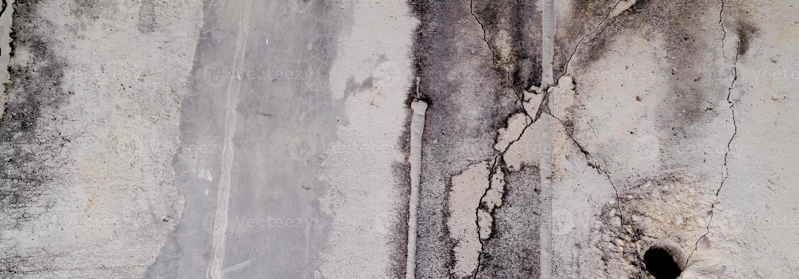 parete strutturata con grigio. struttura del cemento cemento leggermente grigio chiaro per lo sfondo. trama astratta della vernice. foto