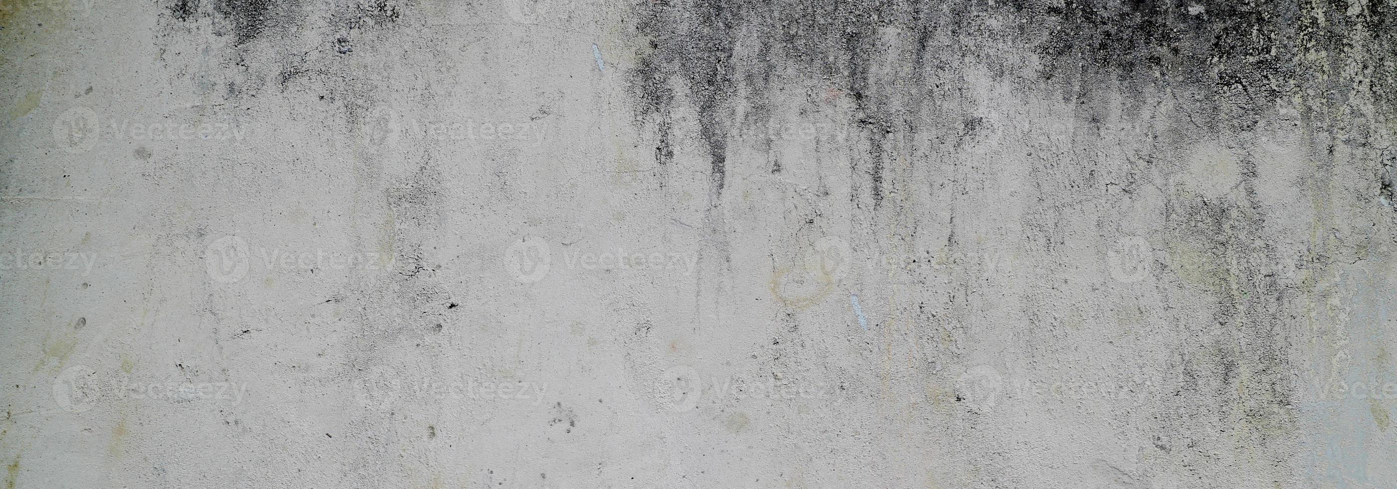 parete strutturata con grigio. struttura del cemento cemento leggermente grigio chiaro per lo sfondo. trama astratta della vernice. foto