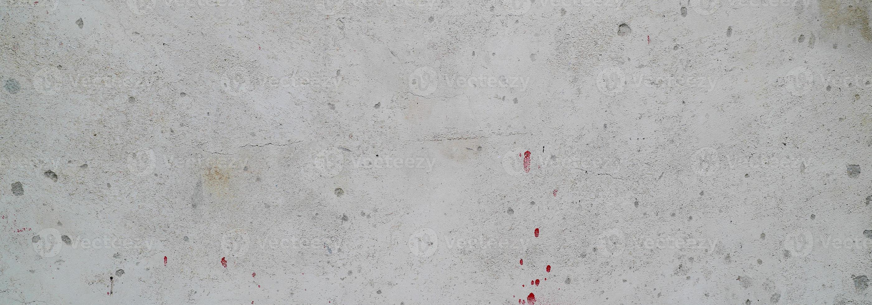 parete strutturata con grigio. struttura del cemento cemento leggermente grigio chiaro per lo sfondo. trama astratta della vernice. foto