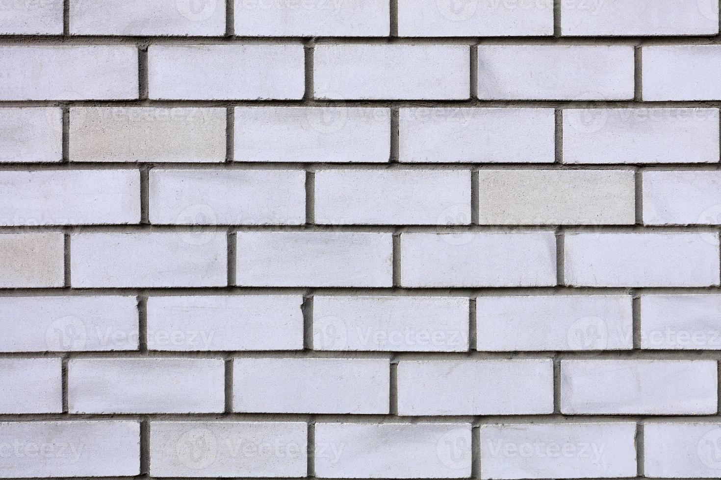 primo piano di struttura del muro di mattoni bianco e grigio foto