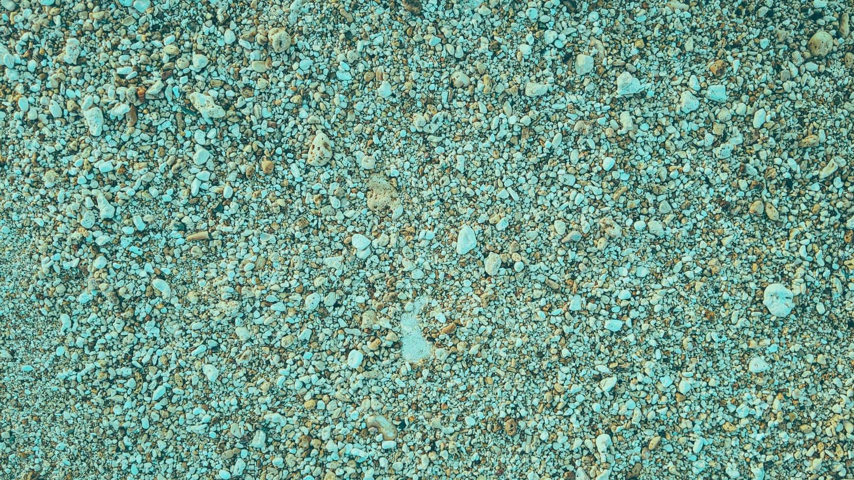 roccia ciottoli spiaggia di sabbia naturale texture astratta sfondo foto