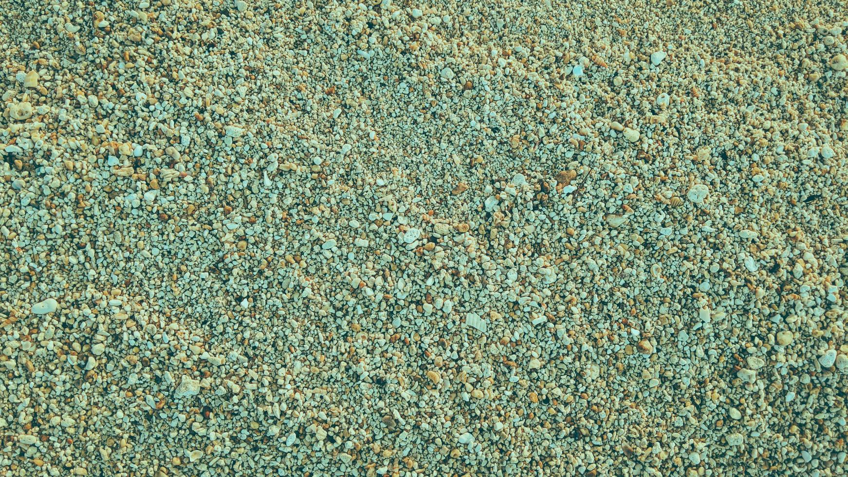 roccia ciottoli spiaggia di sabbia naturale texture astratta sfondo foto