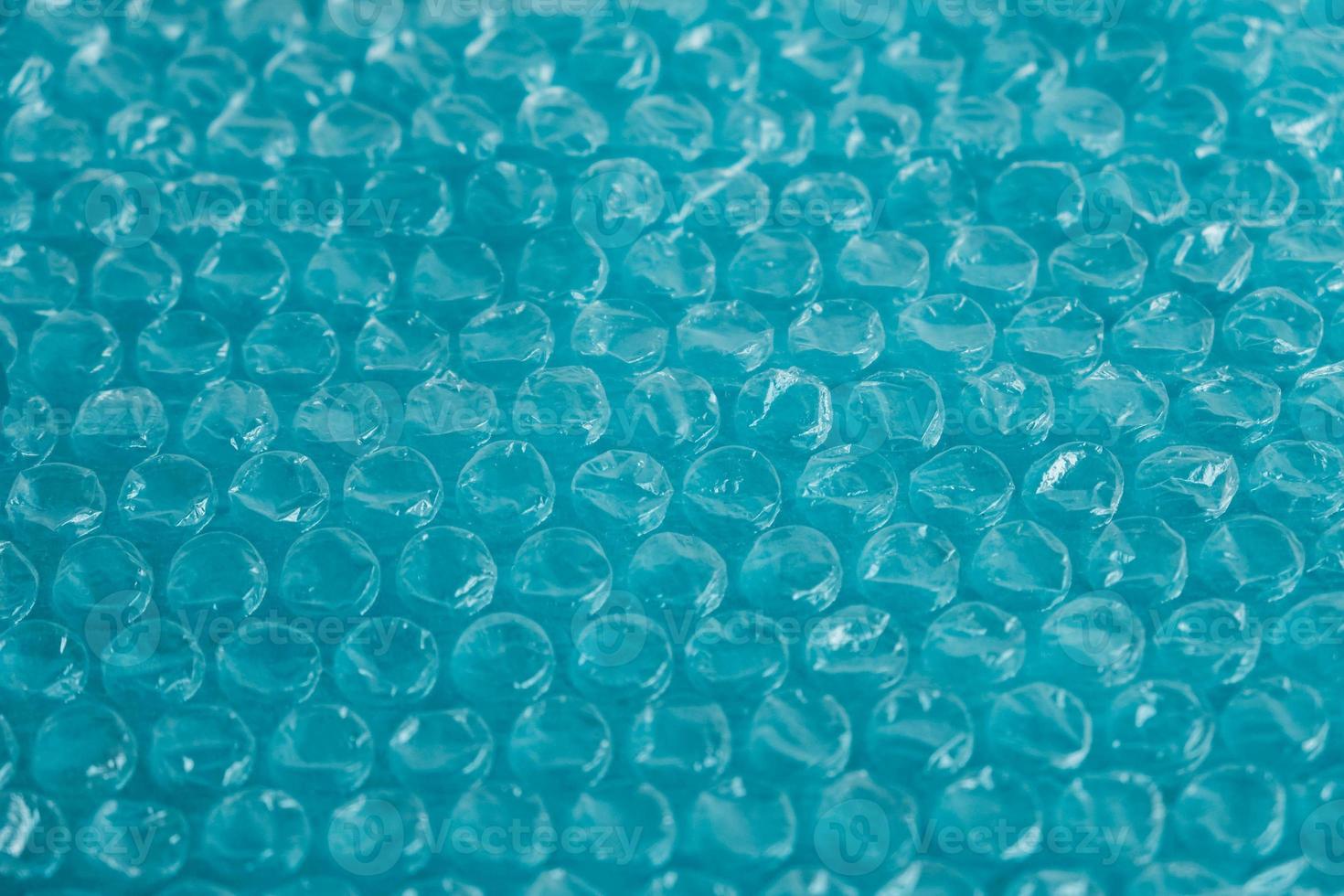 imballaggio con bolle d'aria su sfondo blu. struttura a bolle d'aria, imballaggio, film a bolle d'aria. copia, spazio vuoto per il testo foto