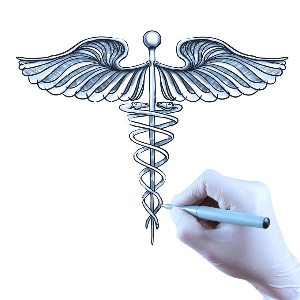 la mano del medico disegna il caduceo foto