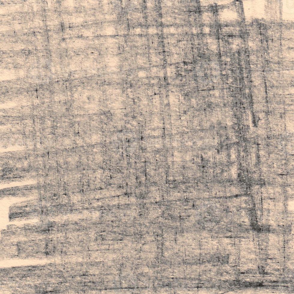 morbidi tratti di matita grigia su sfondo di carta foto