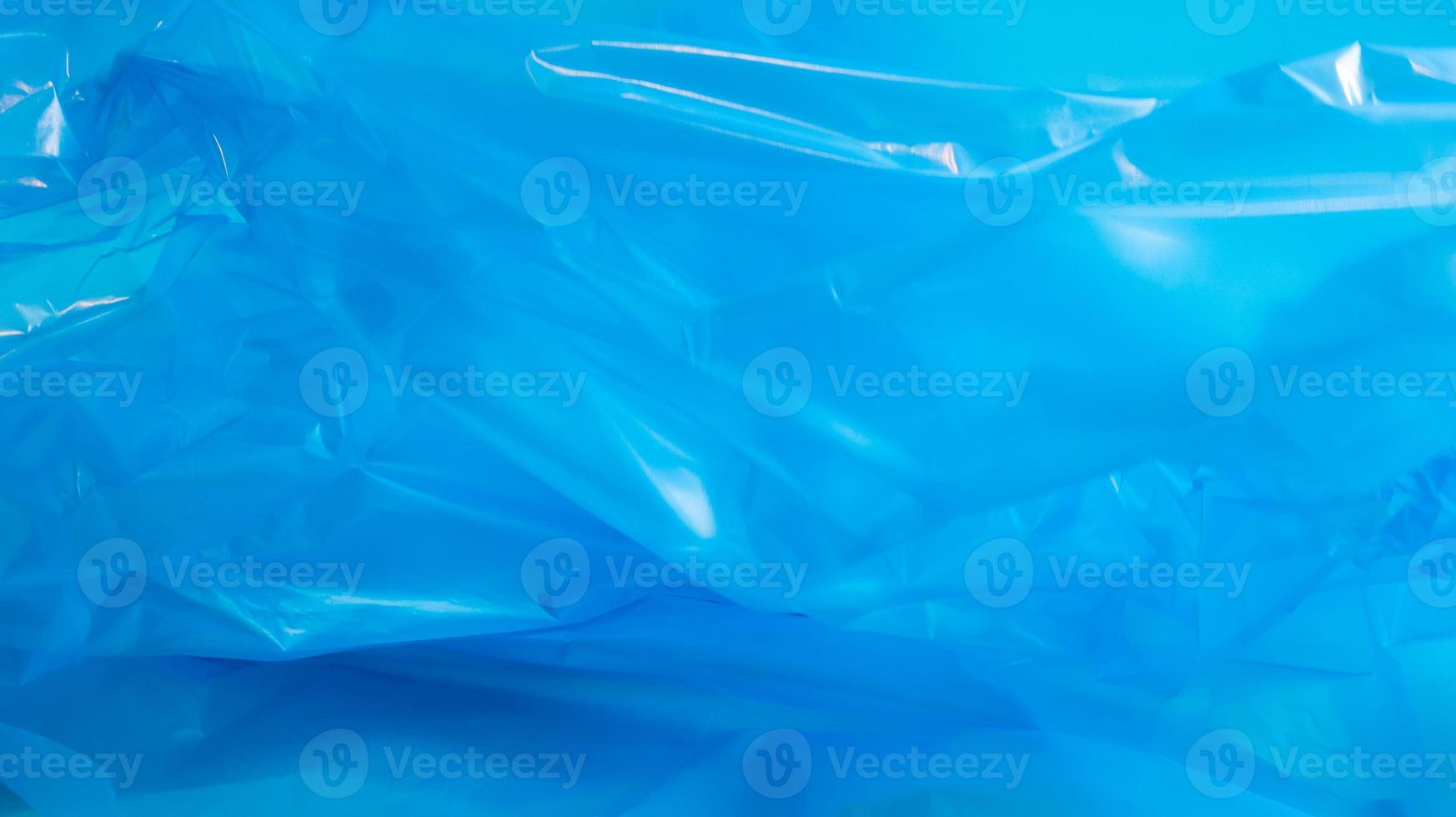 struttura e fondo del sacchetto di plastica blu. un sacchetto progettato per accogliere i rifiuti al suo interno e viene utilizzato a casa e collocato in vari contenitori della spazzatura. foto