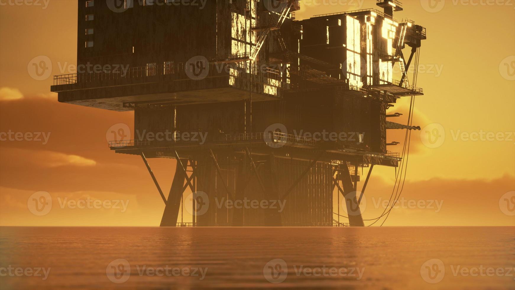 vecchia piattaforma petrolifera durante il tramonto nell'oceano foto
