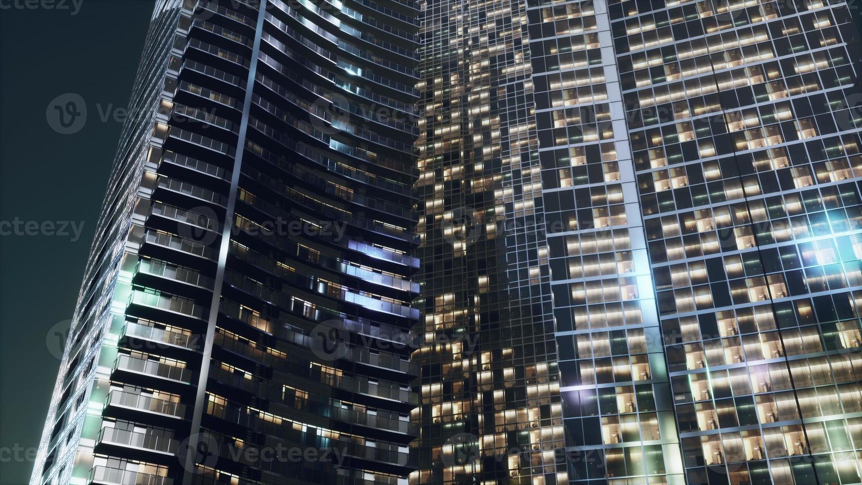 architettura notturna di grattacieli con facciata in vetro foto