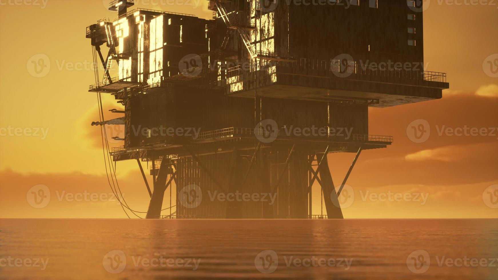 vecchia piattaforma petrolifera durante il tramonto nell'oceano foto