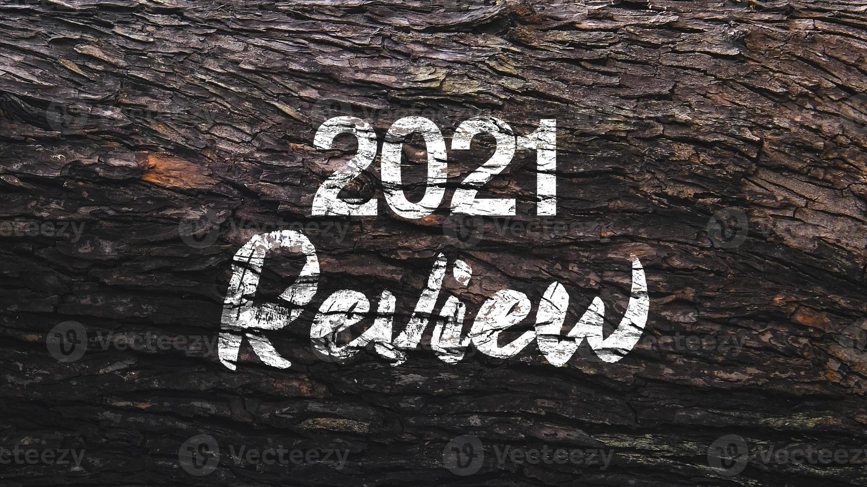 Iscrizione recensione 2021 su fondo in legno di mogano foto