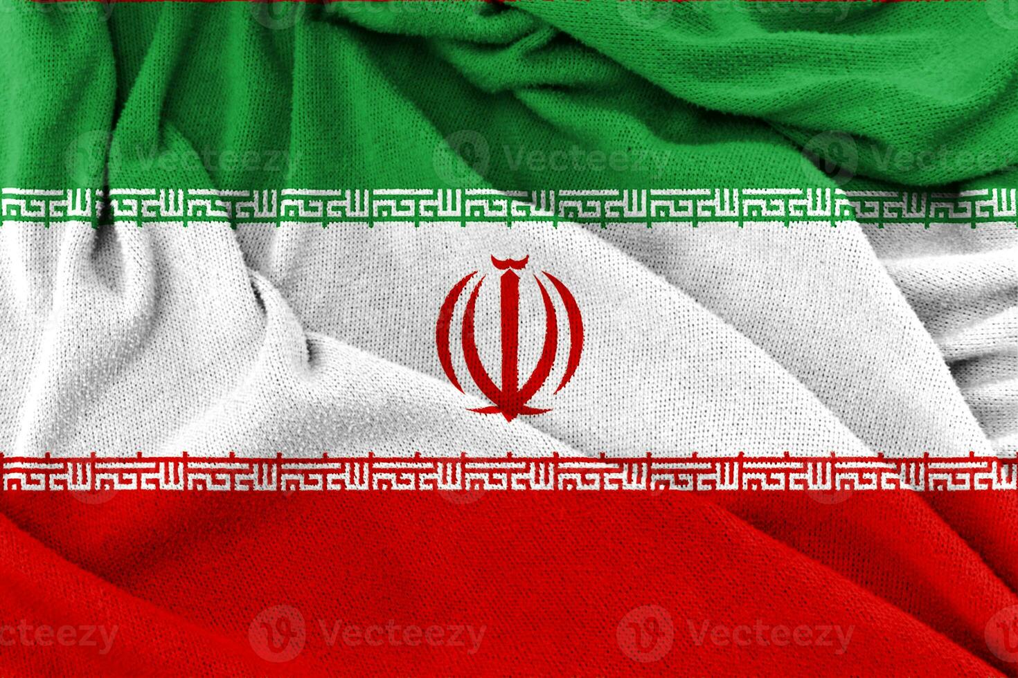 trama del tessuto dello sfondo della bandiera nazionale iraniana. foto