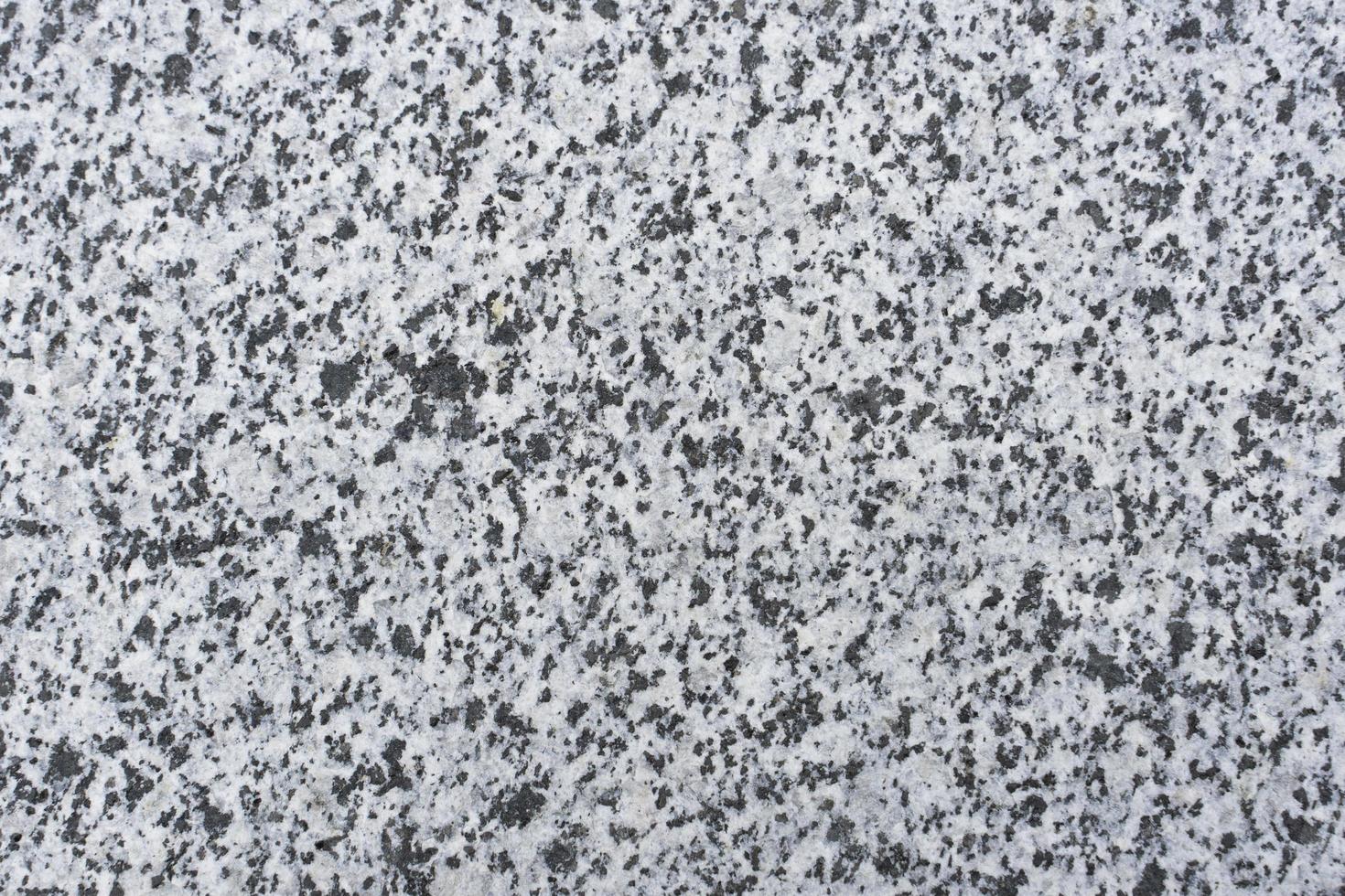 la trama del marmo è granulosa da vicino di colore grigio e bianco foto