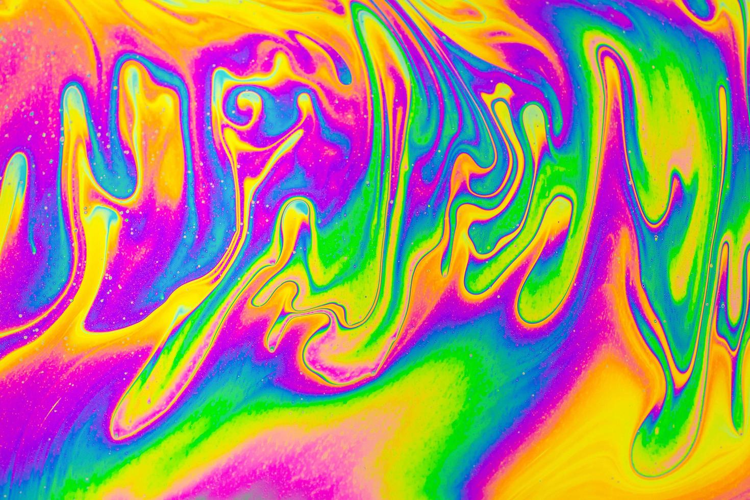 colori dell'arcobaleno. sfondo di modelli psichedelici multicolore. foto macro colpo di bolle di sapone