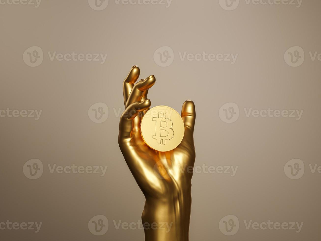 mano d'oro che tiene un bitcoin foto