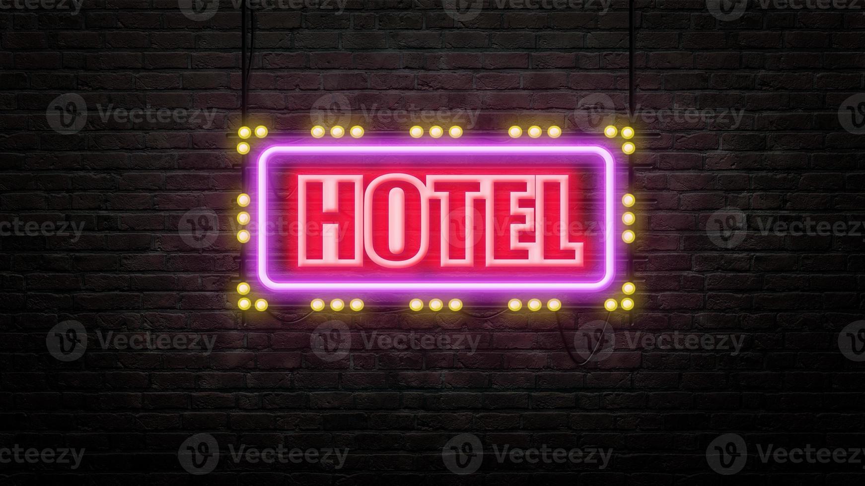 emblema del segno dell'hotel in stile neon su sfondo muro di mattoni foto