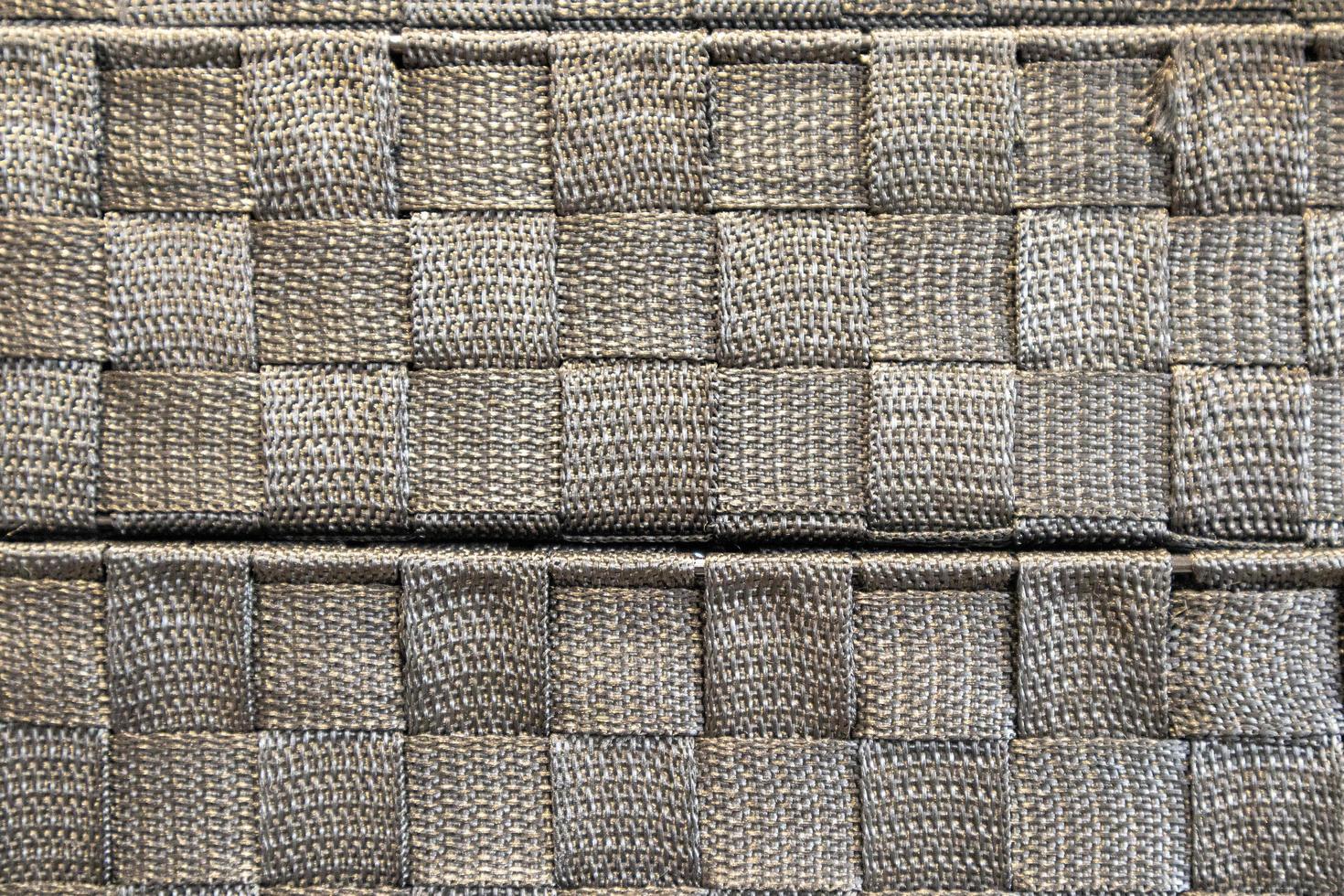 immagine di una trama di stoffa d'argento intrecciata in un quadrato. materiale in tessuto per mobili foto