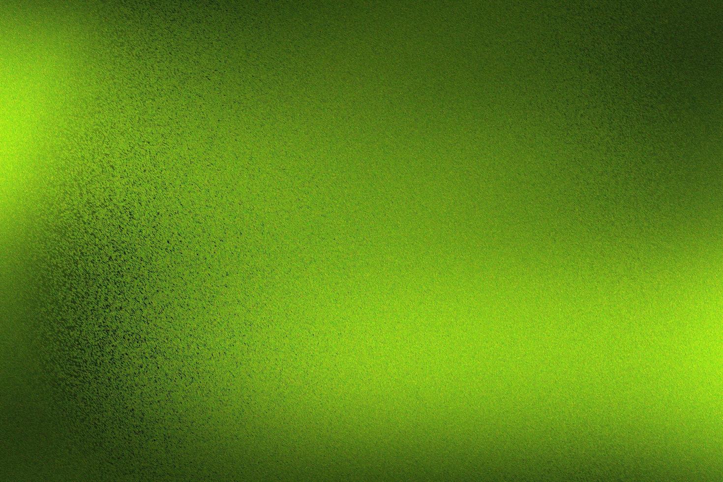 sfondo texture astratta, parete metallica verde ruvida in una stanza buia foto