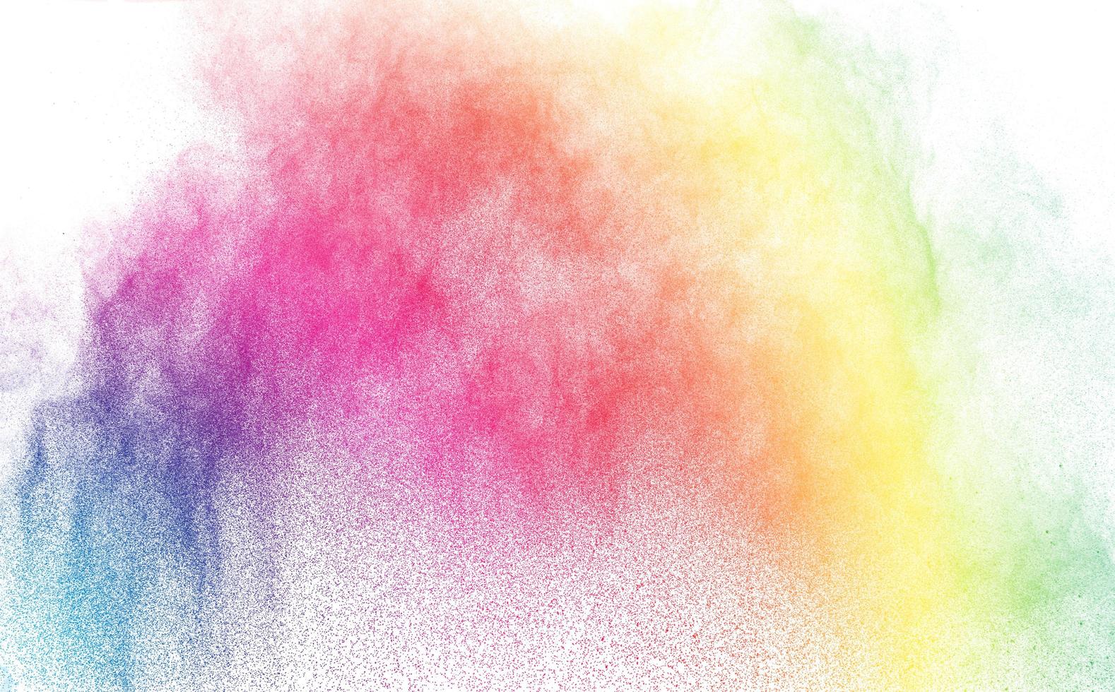 polvere multicolore astratta schizzata su sfondo bianco, congelare il movimento della polvere di colore che esplode foto