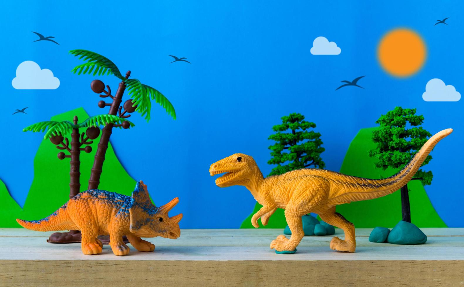 scena di lotta di dinosauri su sfondo di modelli selvaggi foto