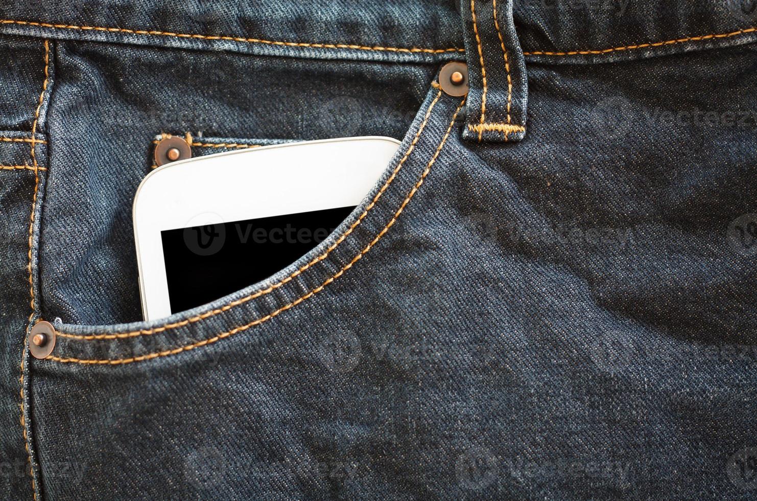 tasca dei jeans con smartphone foto