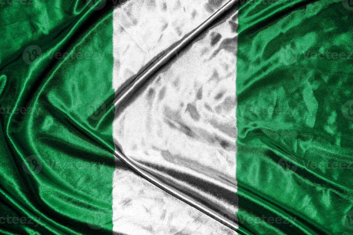 bandiera di stoffa nigeria bandiera di raso sventolando la trama del tessuto della bandiera foto
