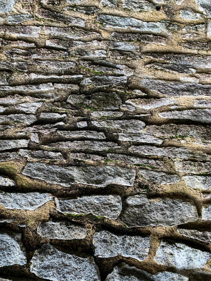 vecchio muro di pietra sullo sfondo. fondale in pietra foto