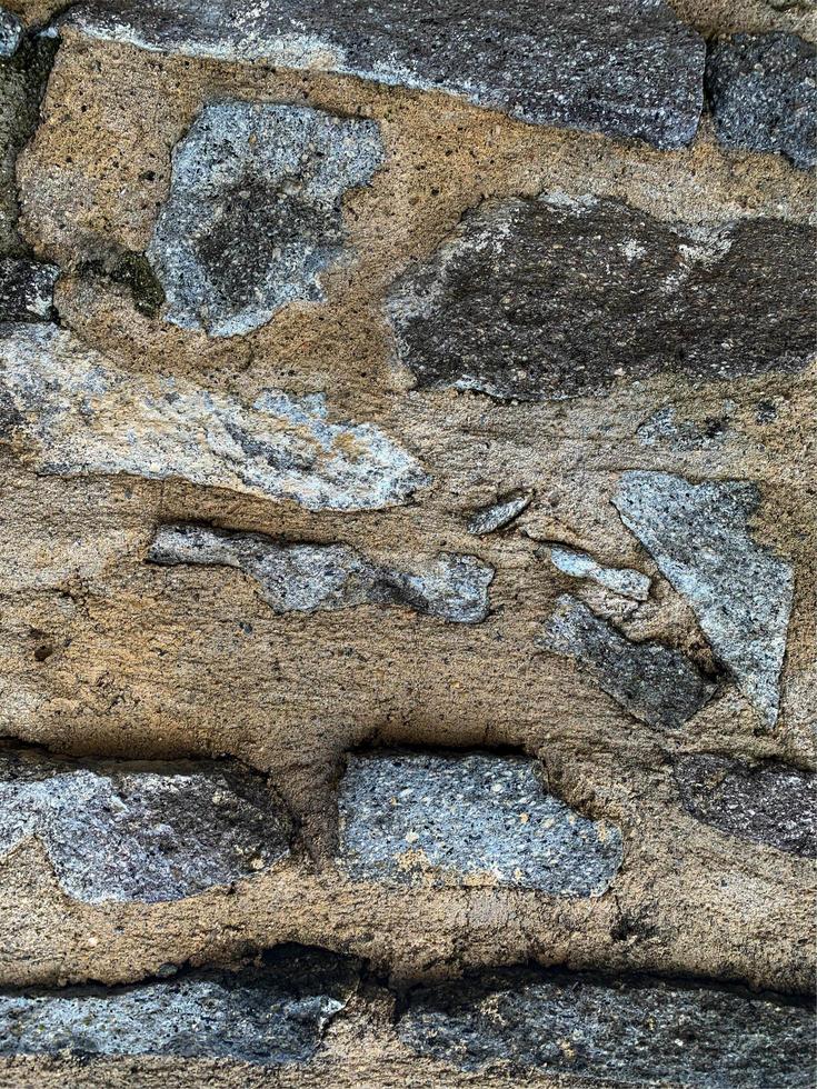 vecchio muro di pietra sullo sfondo. fondale in pietra foto