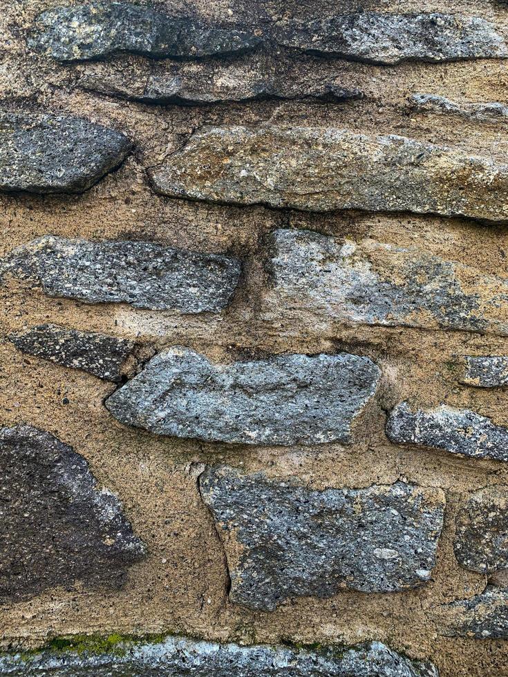 vecchio muro di pietra sullo sfondo. fondale in pietra foto