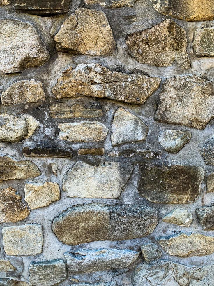 vecchio muro di pietra sullo sfondo. fondale in pietra foto