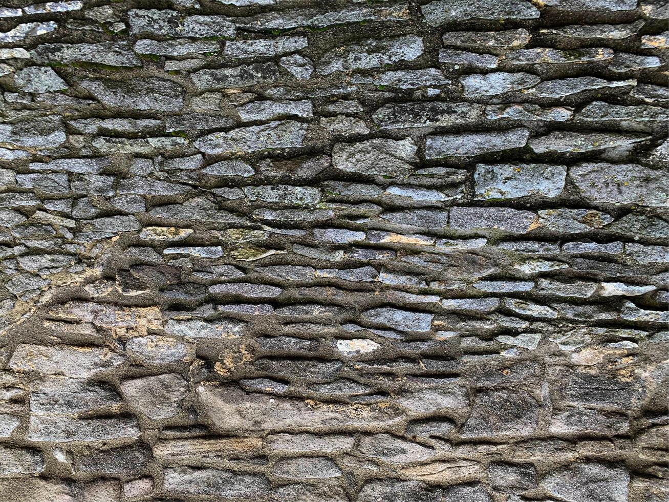 vecchio muro di pietra sullo sfondo. fondale in pietra foto