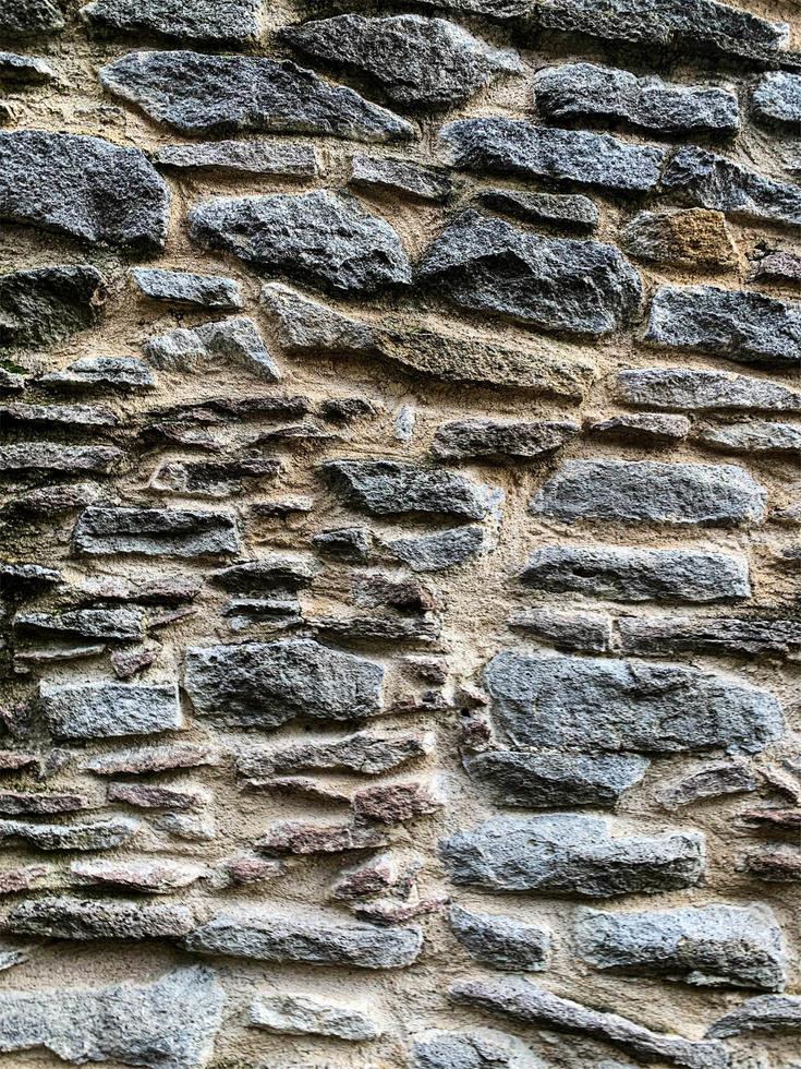 vecchio muro di pietra sullo sfondo. fondale in pietra foto