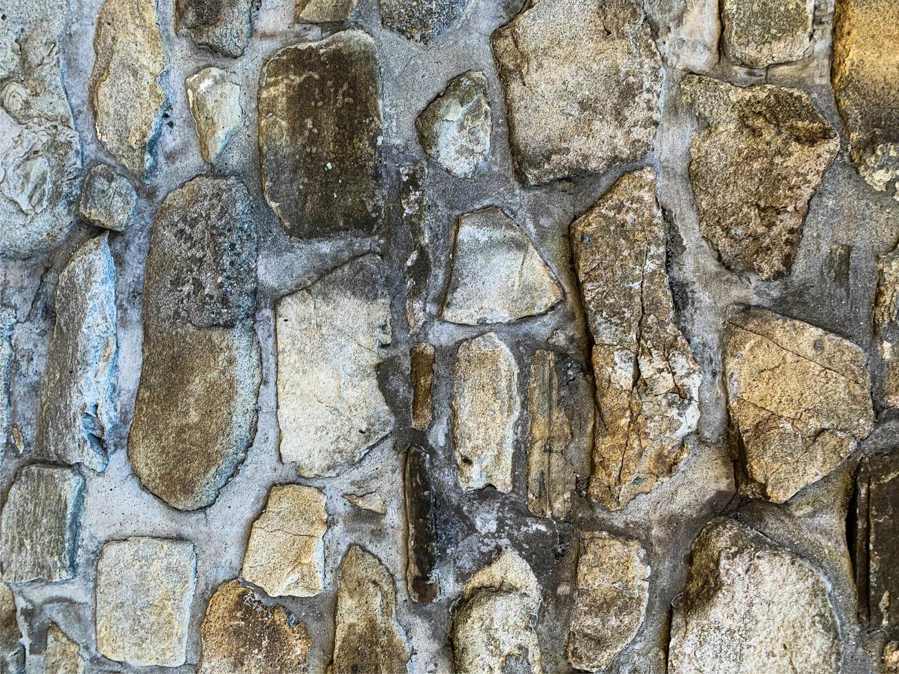 vecchio muro di pietra sullo sfondo. fondale in pietra foto