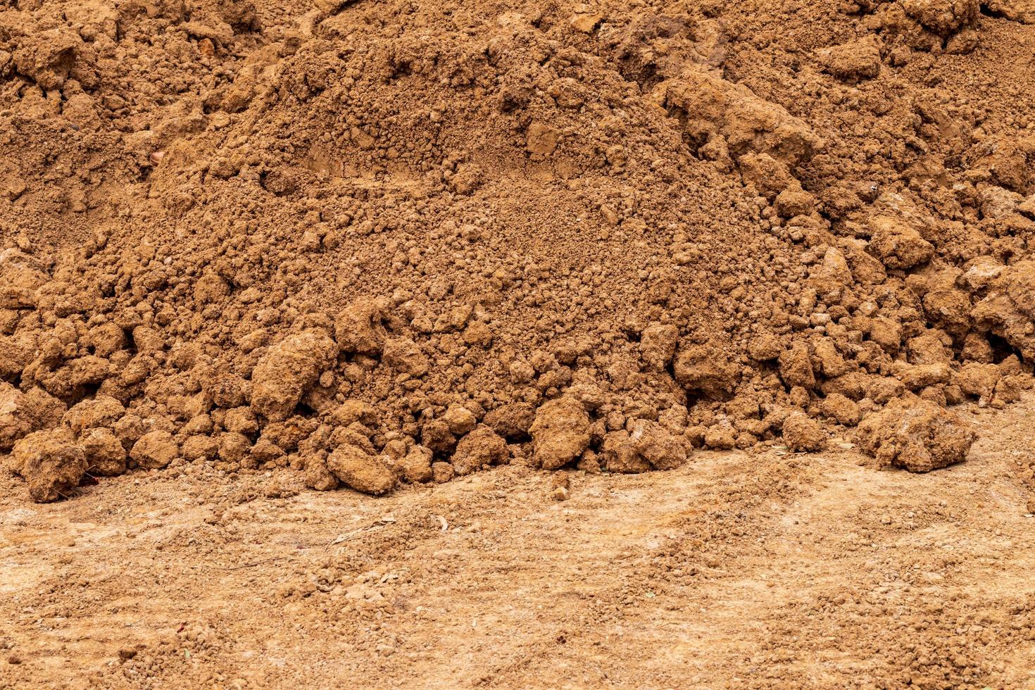 lo sfondo di un mucchio di terriccio sabbioso a terra. foto