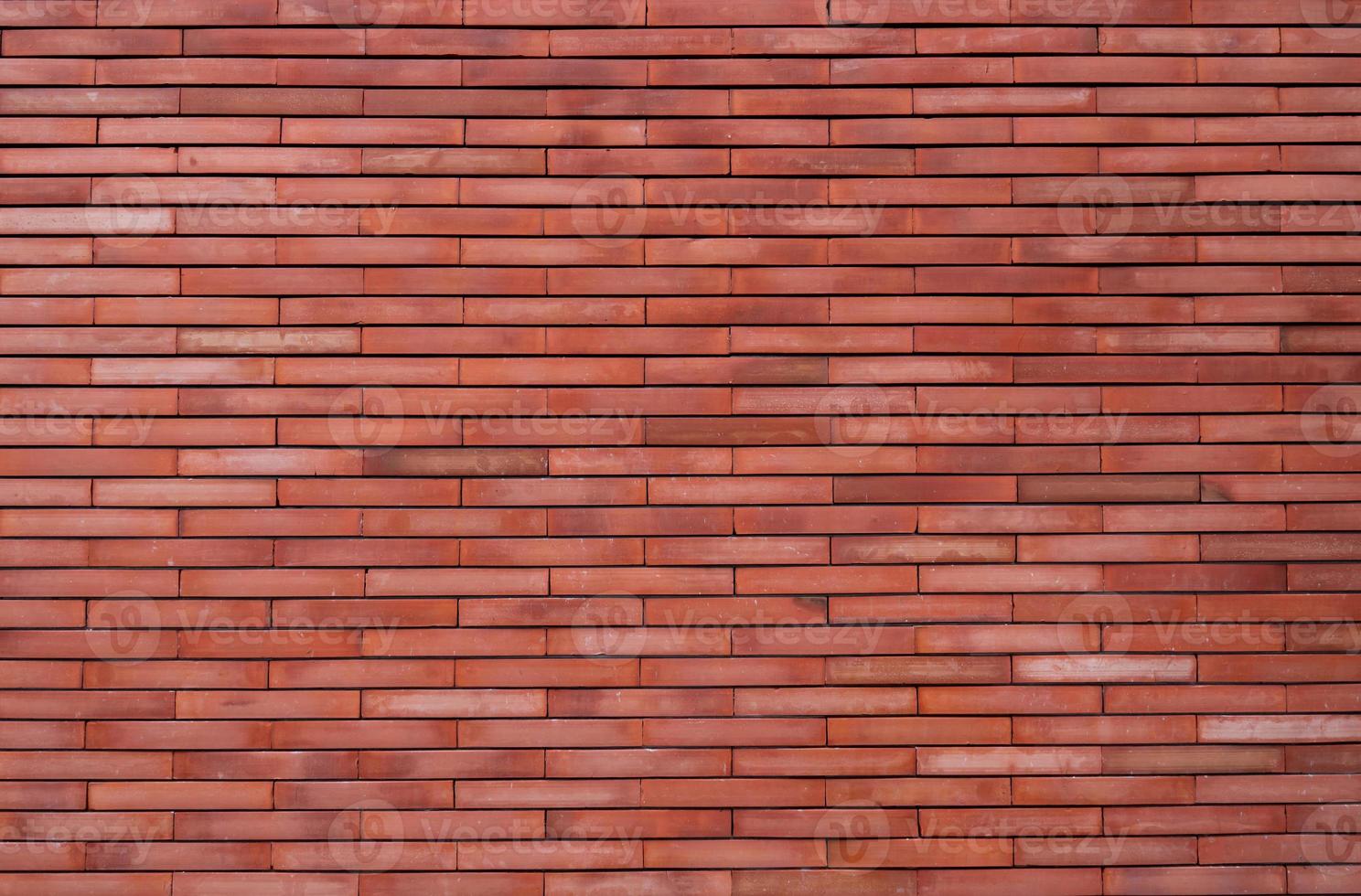 sfondo di struttura del muro di mattoni arancione. carta da parati arancione modello vintage. muro di mattoni vuoto. sfondo di muro di mattoni di tonalità arancione. design d'interni per pareti domestiche. muro arancione della casa. mattone di colore arancio chiaro. foto