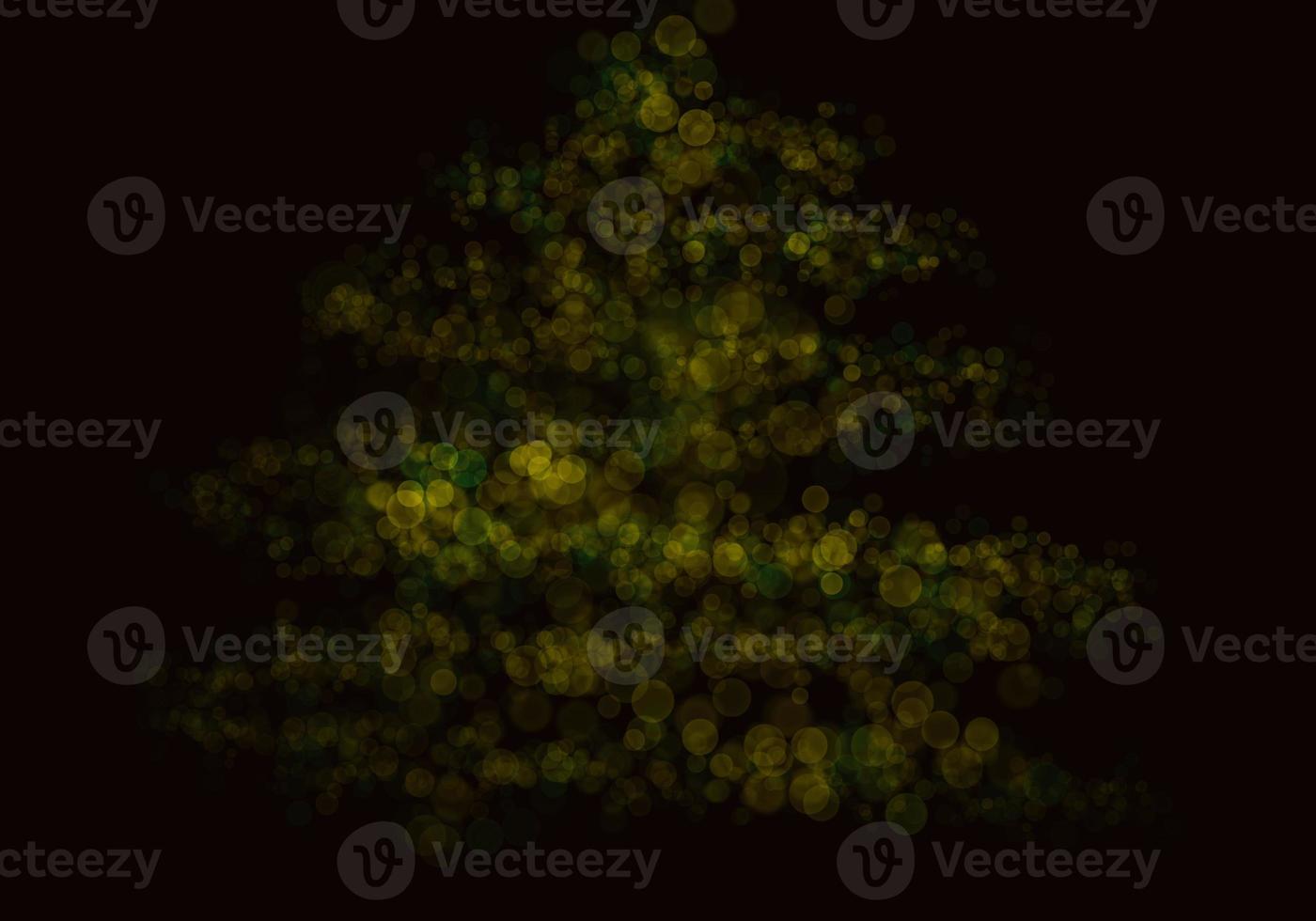 sfondo bokeh giallo dorato c'è una scintilla di luci, idee per feste di Natale e Capodanno. foto