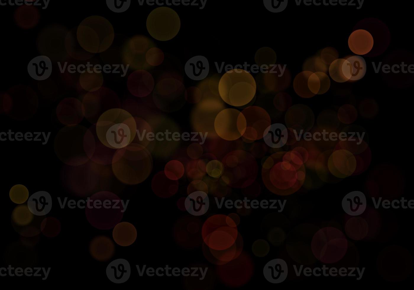 sfondo bokeh giallo dorato c'è una scintilla di luci, idee per feste di Natale e Capodanno. foto