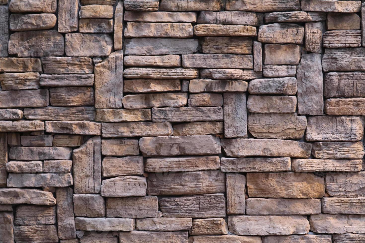 struttura esterna esterna di pietra antica della parete di granito foto