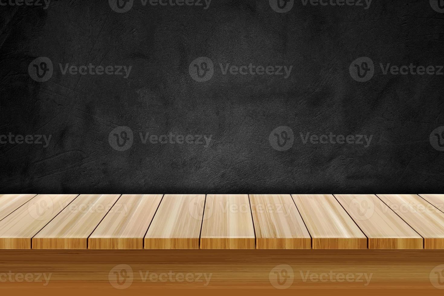 tavolo di legno vuoto su lavagna testurizzata nera per la visualizzazione del prodotto foto
