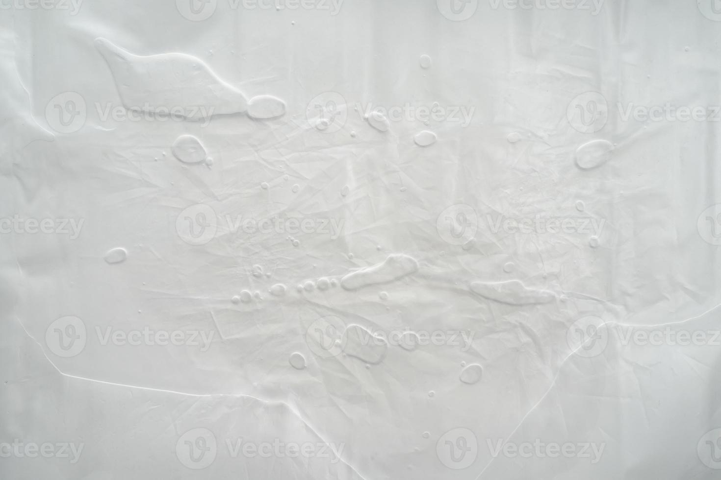 sfondo bianco in plastica stropicciata, messa a fuoco morbida foto