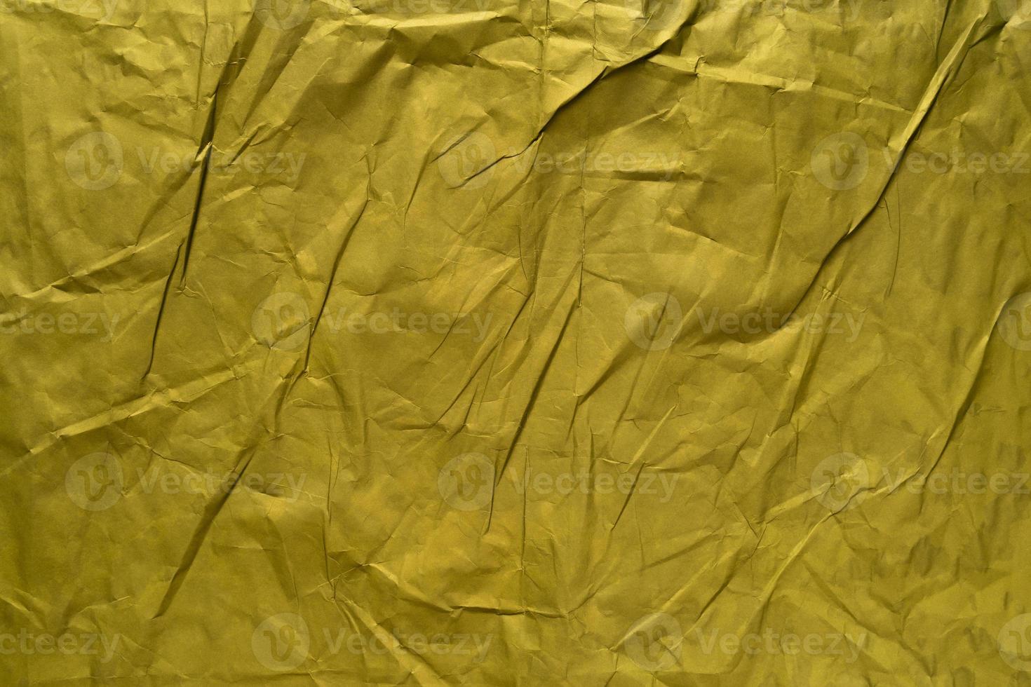sfondo di texture di carta stropicciata oro foto