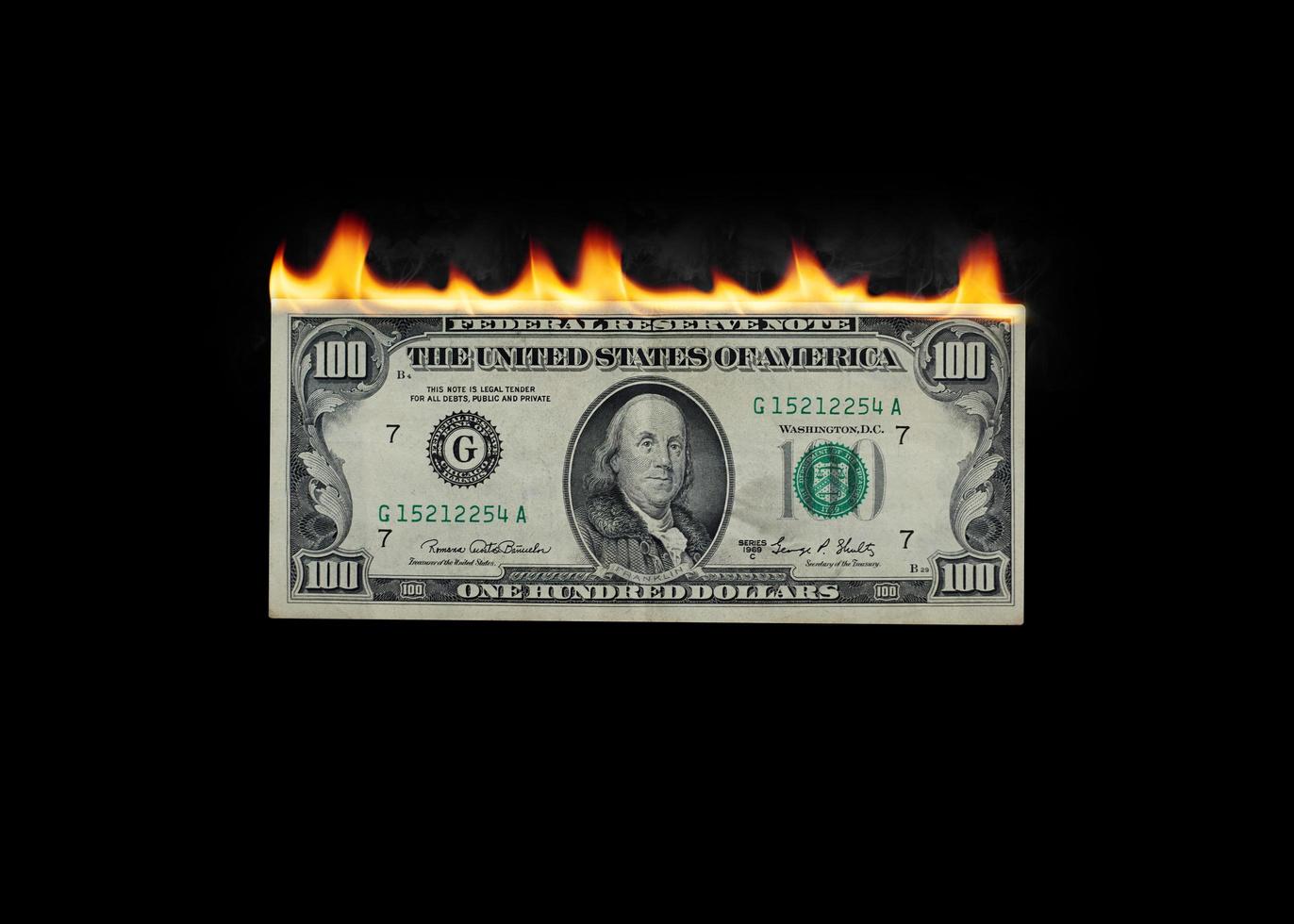 immagine del dollaro in fiamme su sfondo nero foto