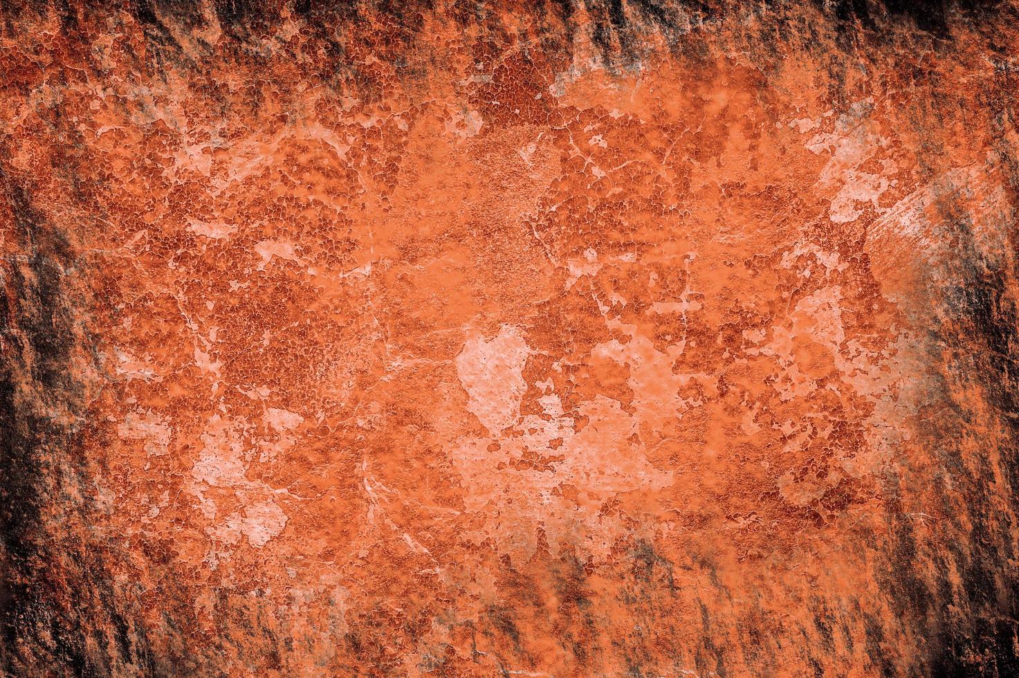 struttura arancione brillante simile a carta bruciata o superficie arrugginita foto