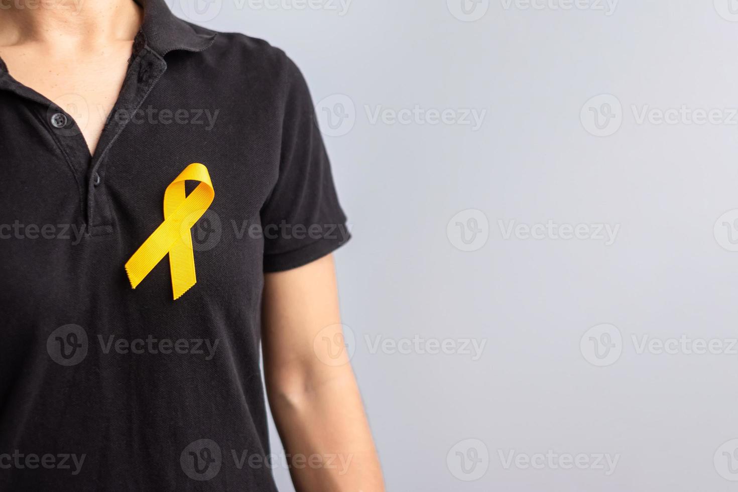 giornata di prevenzione del suicidio, infanzia, sarcoma, mese di sensibilizzazione sul cancro alle ossa e alla vescica, nastro giallo per sostenere la vita e la malattia delle persone. concetto di assistenza sanitaria per bambini e giornata mondiale del cancro foto