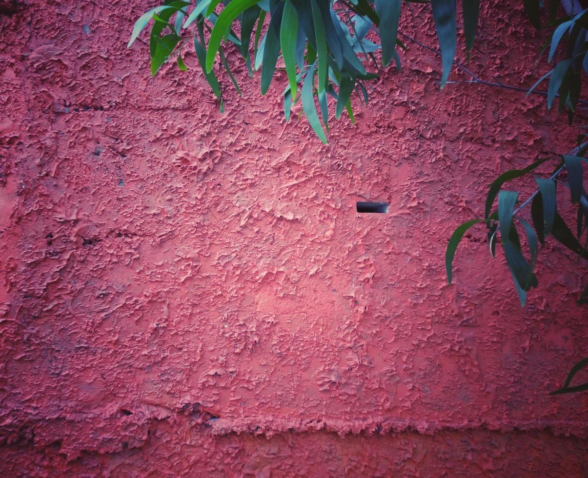 struttura ruvida del muro di cemento, vignetta rosso scuro, stile vintage, può essere utilizzata come sfondo e carta da parati. foto