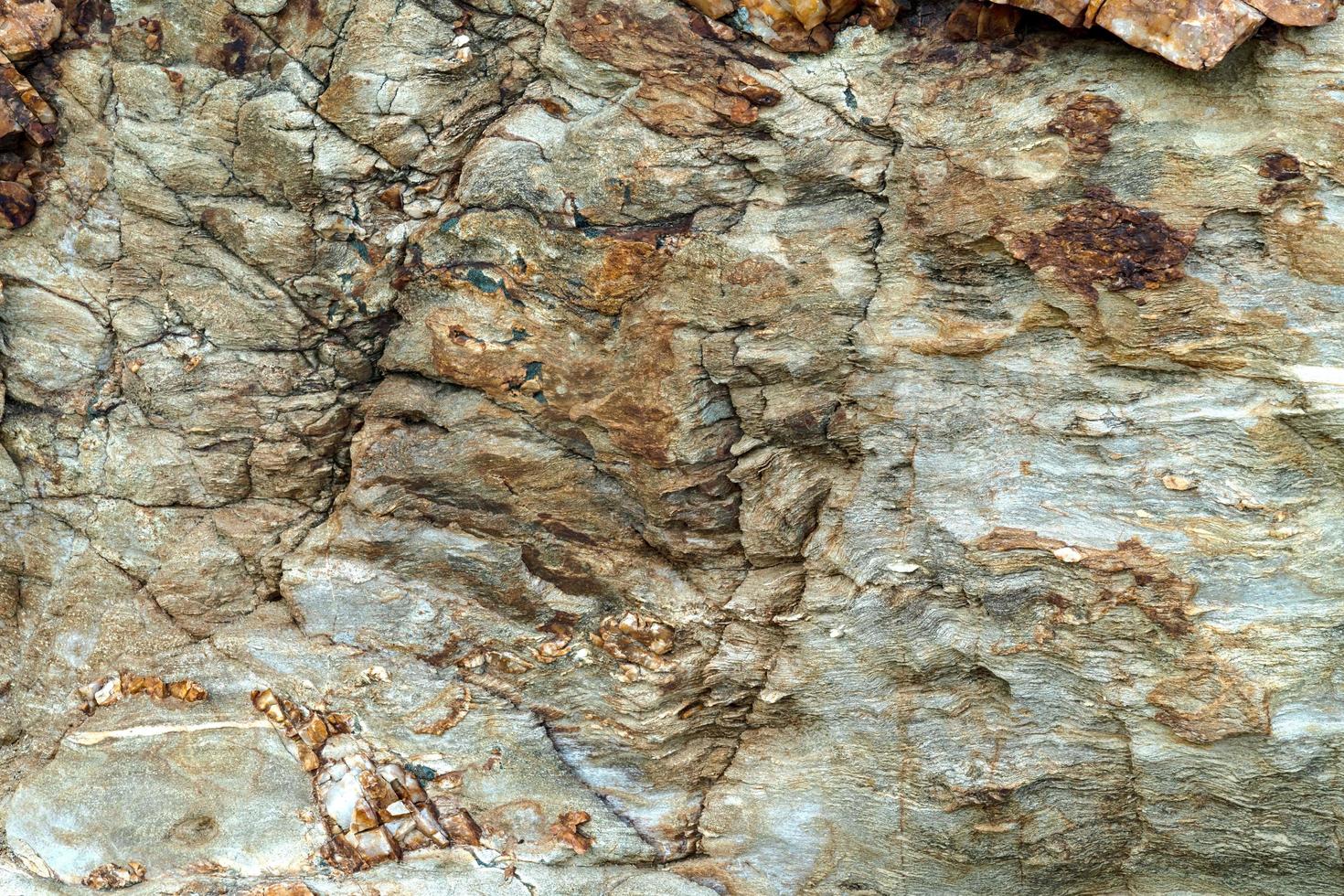 fondo marrone della roccia ignea del primo piano foto