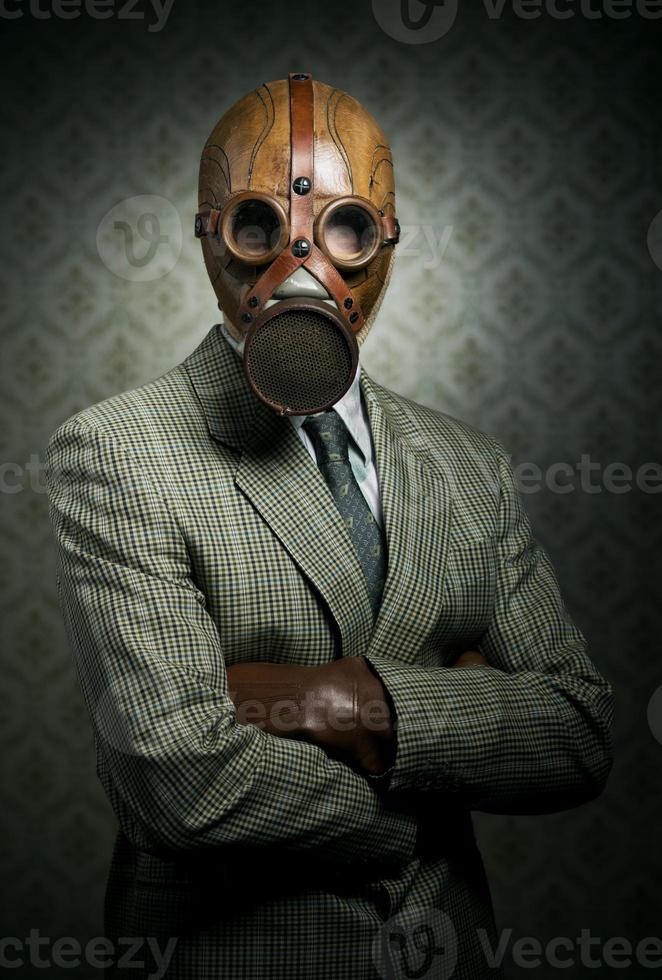 maschera antigas da portare dell'uomo d'affari dell'annata foto