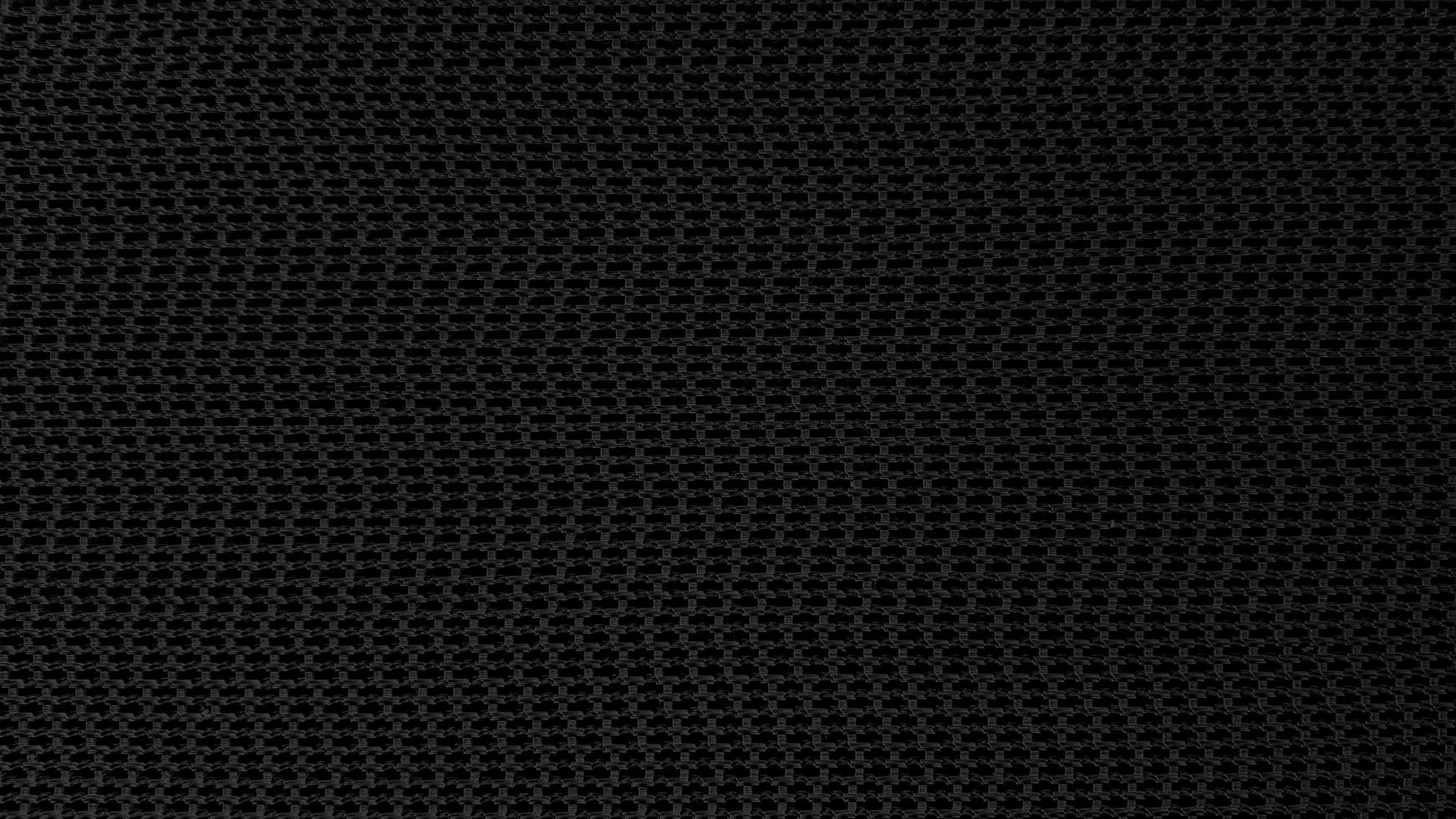 sfondo nero astratto senza cuciture. carta da parati artistica e trama della superficie del nastro trasportatore foto
